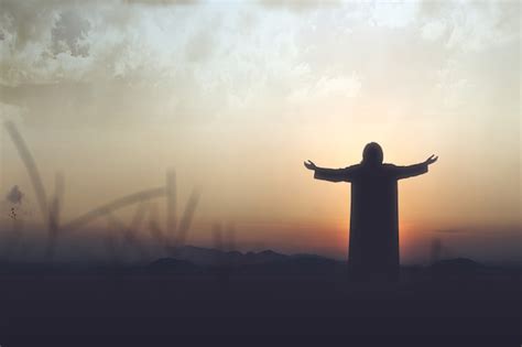 Premium Photo Silhouette Of Jesus Christ Raised Hands And Praying To God