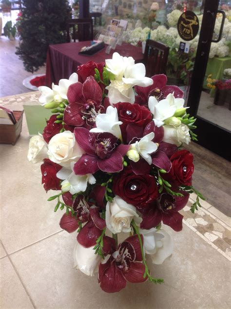 Cascade Bridal Bouquet With Burgundy Cymbidium Orchids Red Roses White Roses And White Free