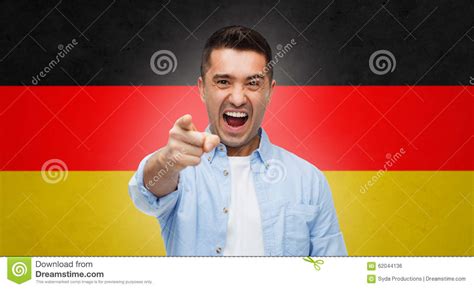 Angry Man Pointing Finger On You Over German Flag Stock Photo Image