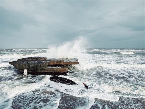 Premium Photo Storm Waves Crashes Against Rocks Of Sea Coast On