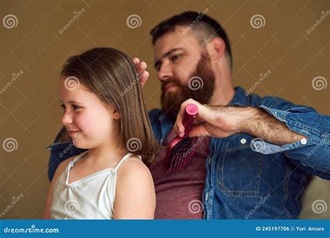 Aww Inspiring Moments Shot Of A Father Brushing His Daughters Hair At