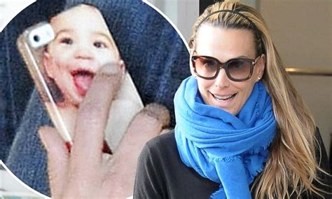 Model Mom Molly Sims Flashes Photo Of Son Brooks Printed On The Back Of