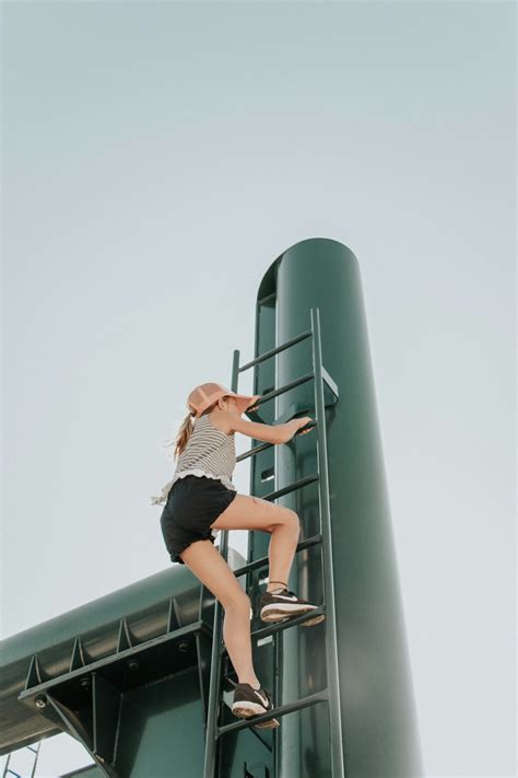woman climbing ladder photo free person image on unsplash