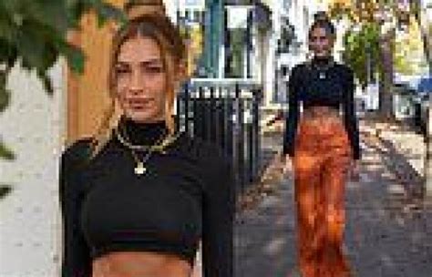 Zara Mcdermott Flashes Her Washboard Abs In A Black Crop Top