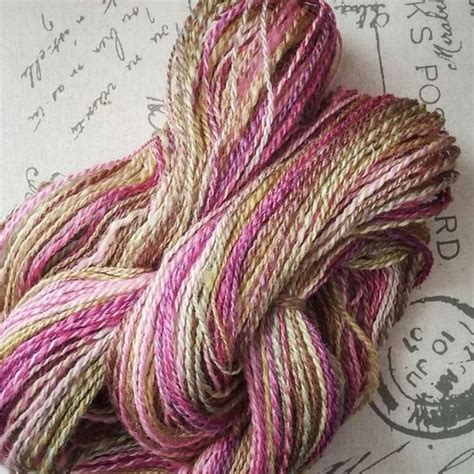 With stitches sewn into the yarn you can knit with no tools. Here's a lovely spin of our colorway First Bloom by Sally ...
