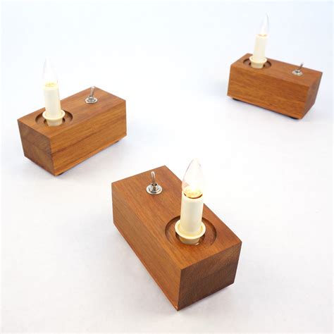 Each candle requires 2 aa batteries (not included). Small Lamp 'Candle', Iroko wood, battery operated | ZzzDesign