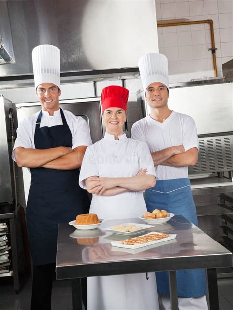 Confident Chefs With Sweet Dishes On Kitchen Stock Image Image Of Girl Chef 36378523