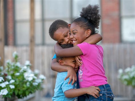Three Children Hugging Each Other Tight Atlanta Mission