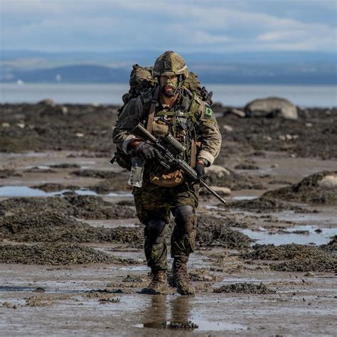 A Canadian Soldier Securing A Beach During The Patrol Pathfinder Course