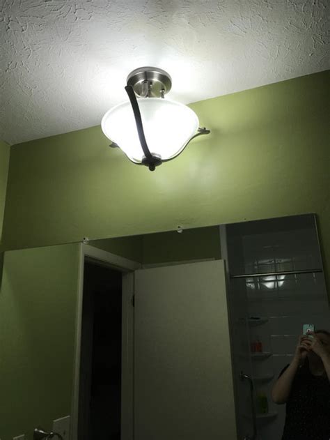 I have a new light fixture that requires being mounted to a box and weighs about 10 pounds. Need help finding bathroom light - not centered junction box