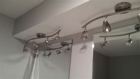 This kind of hanging light fixture is very popular. Ideas for bathroom light fixtures. Must be ceiling mounted.