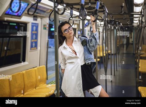 Sexy And Beautiful Model Is Posing In Carriage Of Metro Train Stock