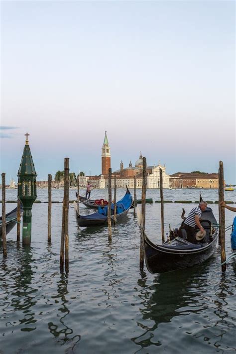 Gondola Boats On The See With The Church Of San Giorgio Maggiore