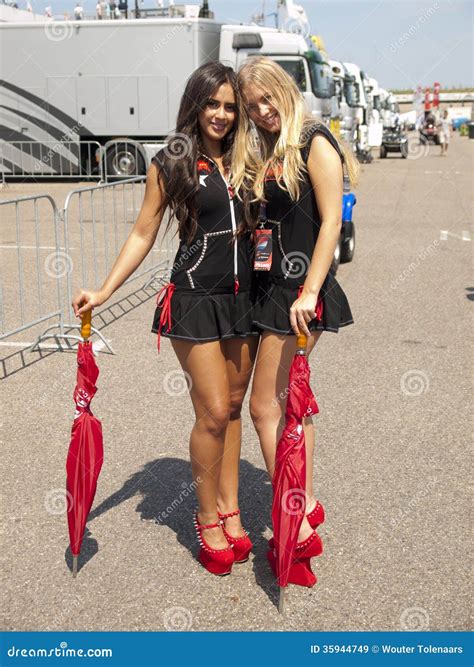 two pitbabes are posing behind the pitlane editorial stock image image of portrait pitbabes