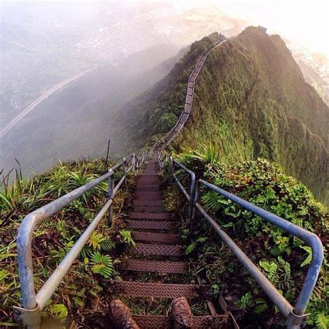Stairs Leading Up To The Top Of A Mountain With Green Vegetation On