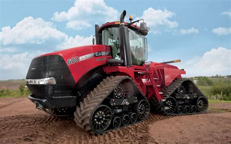 Download Powerful Red Case Stx Steiger Tractor In A Field Wallpaper