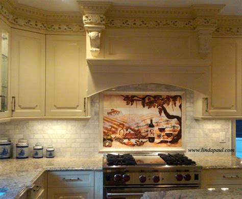 Beautiful italian tile backsplash mural of a kitchen window featuring a still life of olive tiles, grapes, bread, cheese, garlic, olive oil, olives, rosemary, lemons and a hummingbird by american artist linda paul. Mural Backsplash