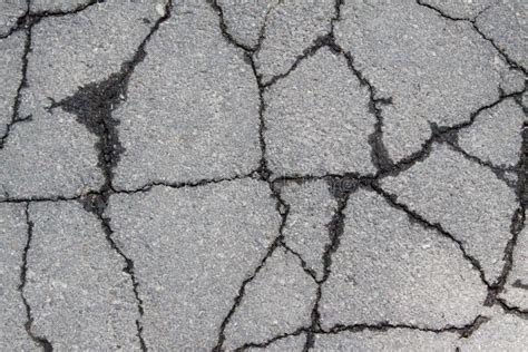 Old Worn And Cracked Asphalt With Cracks Stock Photo Image Of Surface