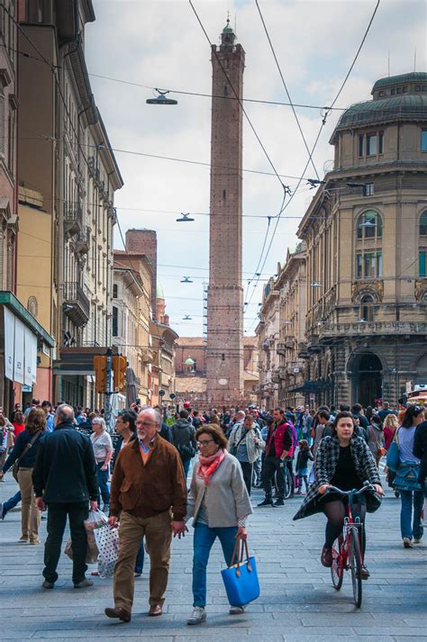 Bologna's busy streets with the Tower of Asinelli - Bologna, Emilia ...