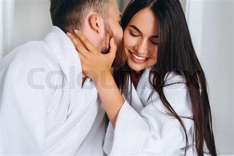 Handsome Man Kissing Beautiful Woman On Cheek While Stock Image Colourbox