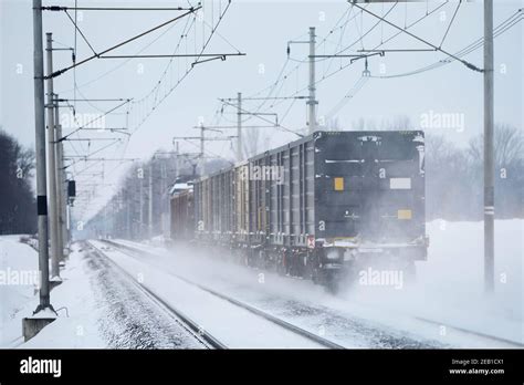 Frosty Winter Day On Railway Freight Train On Snowy Railroad Track