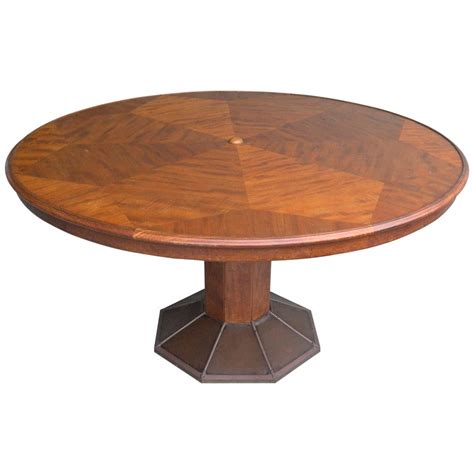 These tables are characterized by plank tops, bench seating, a distressed finish or other rustic details. Extra Large Round Sculptural Wooden Dining Table by H.Pander and Zonen For Sale at 1stdibs