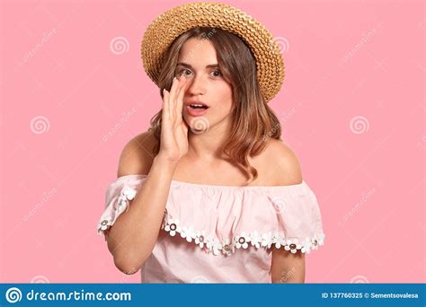 Secret Woman Whispers Something Quietly, Keeps Palm Near Mouth, Wears ...