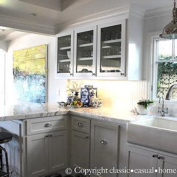Shaker style cabinets, butcher block counter tops, and cast iron sink. Farmhouse KItchen Island - Cottage - kitchen - Sawyer Berson