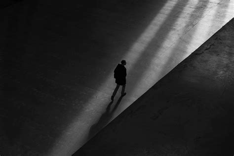 Free Photo Man Walking On Floor Alone Black And White High Angle