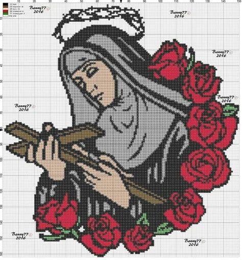 A Cross Stitch Pattern With An Image Of The Virgin Mary Holding A Crucifix
