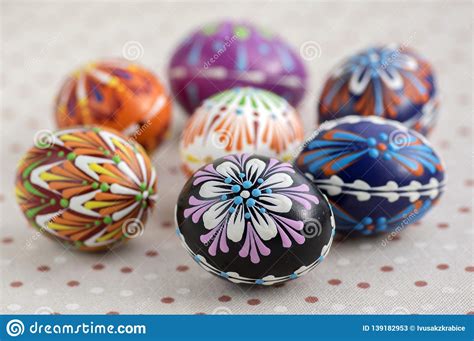 Colorful Painted Easter Eggs On Dotted Tablecloth