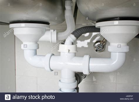 It enters your home under enough pressure to allow it to travel upstairs, around corners, or wherever else it's needed. Drain pipes under a kitchen sink with dishwasher ...