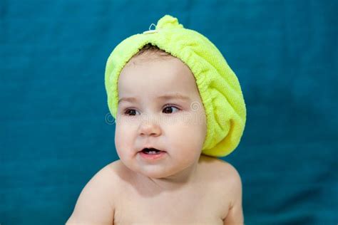 Baby Girl With Yellow Towel As Hat After Bath On Head Caucasian Child