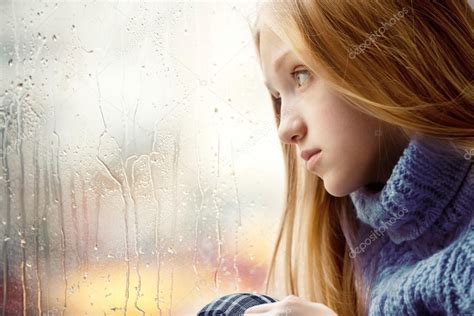 Rainy Day Girl Looking Through The Window — Stock Photo
