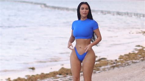 tropical kim kim kardashian shows off killer curves in blue bikini on the beach during sexy