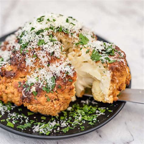 Whole Roasted Cauliflower Baked With Garlic And Cheese