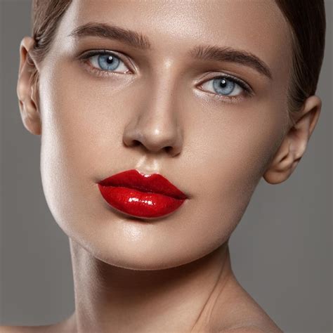premium photo beauty portrait of a beautiful girl natural makeup and red lip color clean
