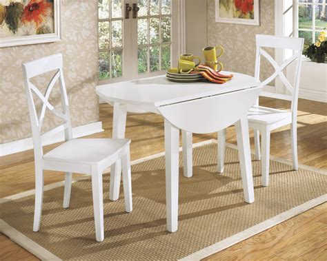 The clearance space for your chairs. Beautiful White Round Kitchen Table and Chairs | HomesFeed