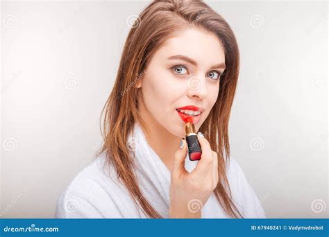 Attractive Lovely Young Woman Testing Red Lipstick On Her Lips Stock