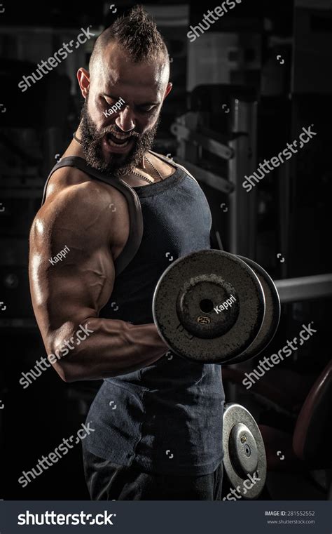 Muscular Man Lifting Some Heavy Dumbells Stock Photo 281552552