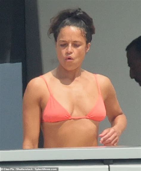 Michelle Rodriguez Puts On A Busty Display In A Tiny Bikini Top As She