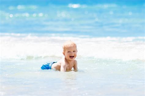 Children Swimming At The Beach