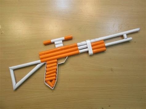 And this is how you can make a rubber band gun fast and cheap! How to make a paper gun that shoots 5 Rubber bands - Easy ...