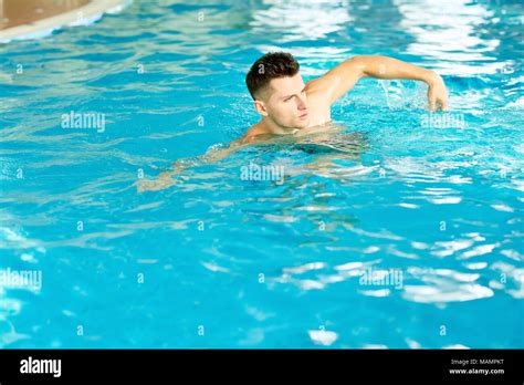 Handsome Man Swimming In Pool Stock Photo Alamy