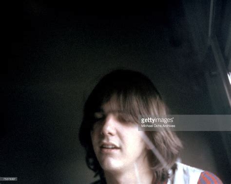 singer songwriter gram parsons plays acoustic guitar backstage in march 1969 in chicago illinois