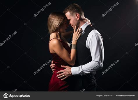 Passionate Man And Woman Hugging Kissing During The Party Stock