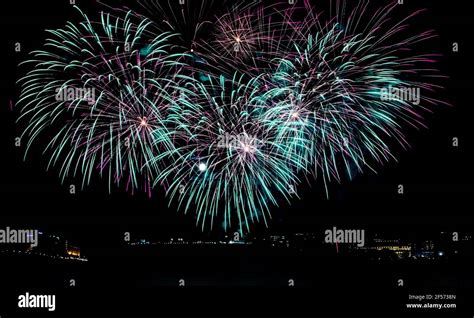Aqua And Purple Fireworks Lighting Up The Night Sky Over Parliament