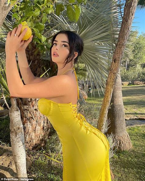 Demi Rose Confidently Showcases Her Hourglass Curves While Holding A Fresh Lemon Exuding Both