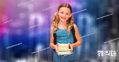 Happy Schoolgirl Holding Books Over Blur Background Stock Photo
