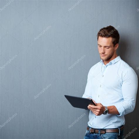 Serious Man Using Digital Tablet Stock Photo By ©racorn 26585267